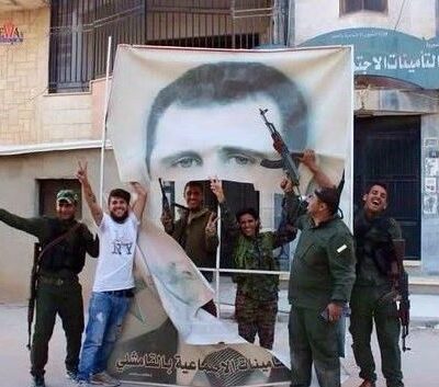 Un portrait de Bashar al-Assad déchiré par les combattants kurdes